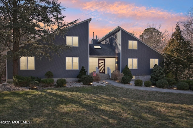 view of front of home with a front lawn