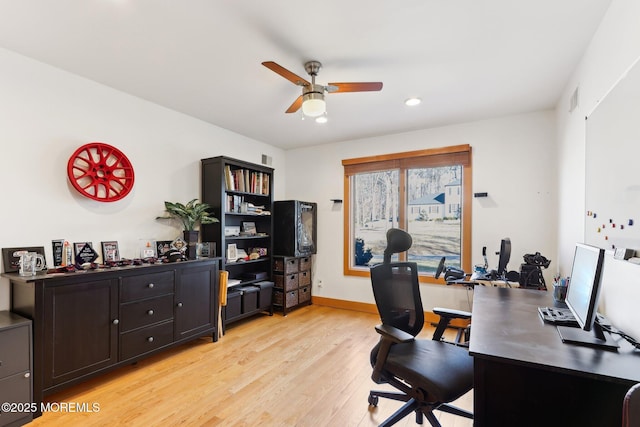 office space featuring light wood-style flooring, baseboards, and ceiling fan