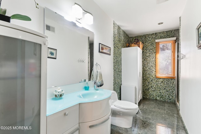 bathroom featuring toilet, radiator, visible vents, and vanity