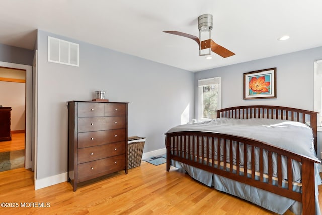 bedroom featuring light wood finished floors, recessed lighting, visible vents, a ceiling fan, and baseboards