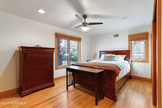 bedroom with light wood finished floors, baseboards, visible vents, a ceiling fan, and recessed lighting