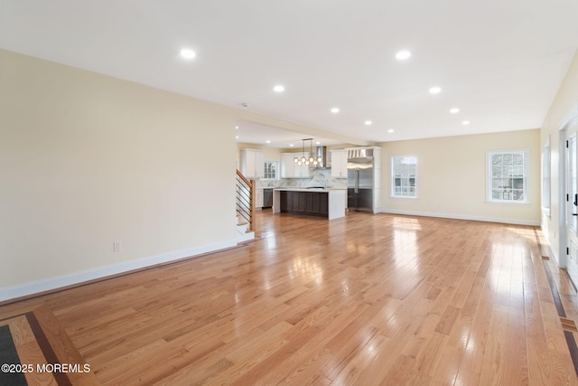 unfurnished living room featuring light hardwood / wood-style flooring