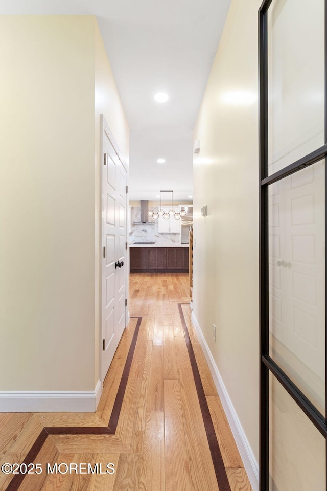 hall featuring light hardwood / wood-style flooring