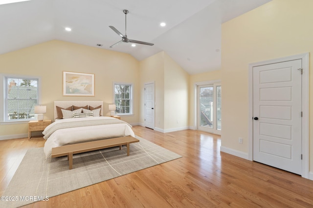 bedroom with lofted ceiling, light hardwood / wood-style flooring, and ceiling fan