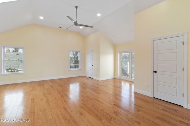 unfurnished living room with vaulted ceiling, ceiling fan, and light wood-type flooring