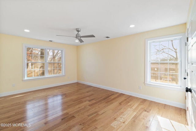 unfurnished room featuring ceiling fan and light wood-type flooring