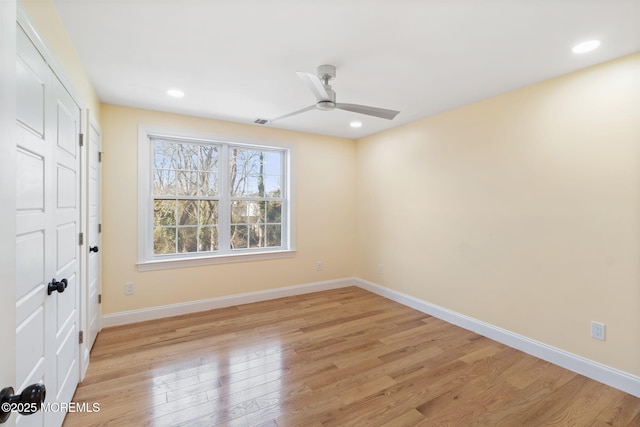 spare room featuring ceiling fan and light wood-type flooring