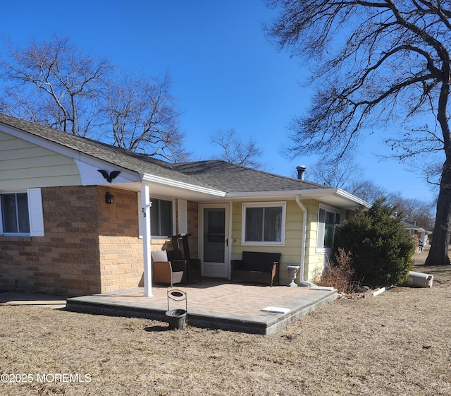 rear view of property with a patio area