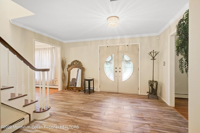 entrance foyer featuring french doors, stairs, and a baseboard radiator