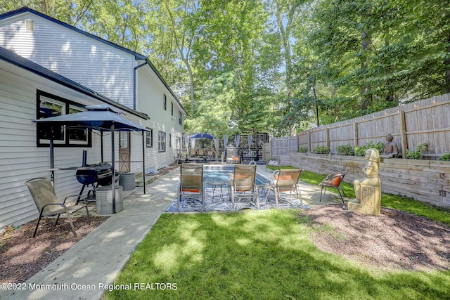 exterior space featuring a patio area and a fenced backyard