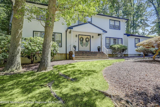 view of front of home with a front lawn