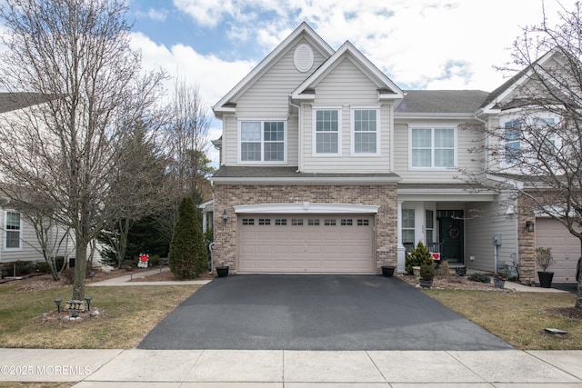 view of front of house featuring a garage and a front yard