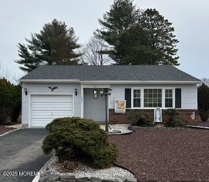 ranch-style house featuring a garage