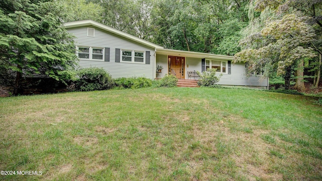 ranch-style home with a front yard