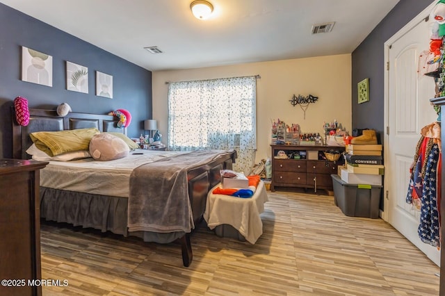 bedroom with light hardwood / wood-style floors