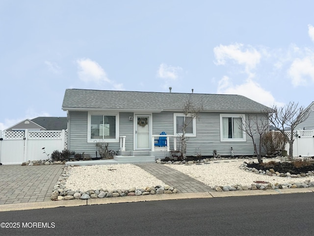 view of front of house featuring fence