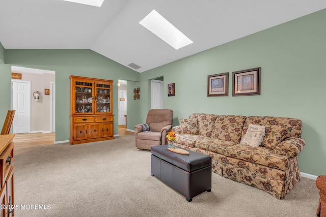 living room with carpet flooring and lofted ceiling with skylight