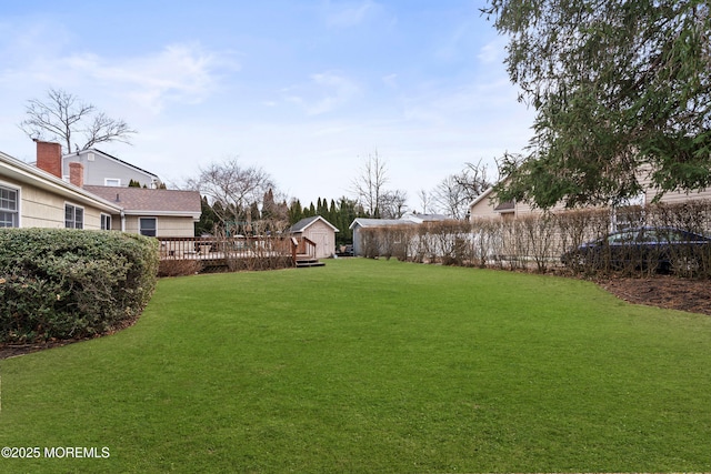 view of yard featuring a wooden deck