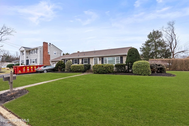 view of front of home featuring a front lawn