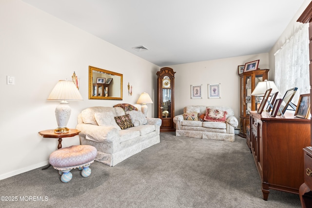 living room with carpet flooring, visible vents, and baseboards