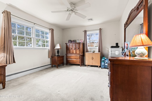 bedroom featuring a ceiling fan, visible vents, light carpet, and baseboard heating