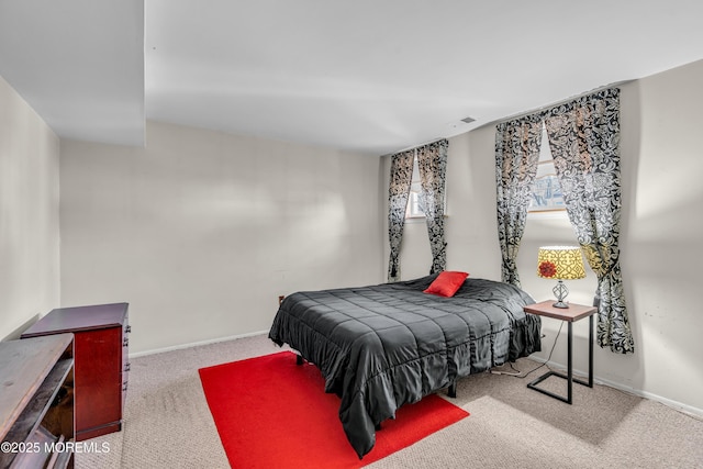 bedroom featuring light carpet