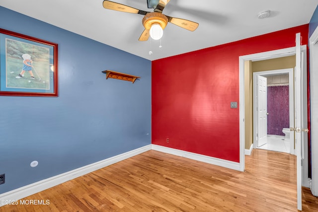 empty room featuring light hardwood / wood-style floors and ceiling fan