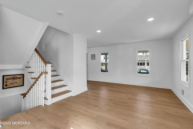 unfurnished living room featuring light wood-type flooring