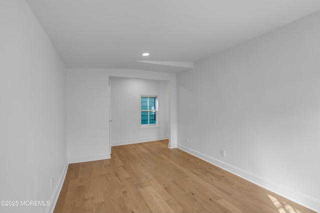 unfurnished room with light wood-type flooring