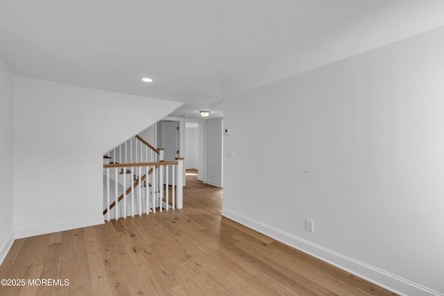 empty room with light hardwood / wood-style flooring