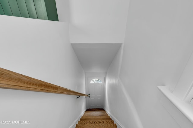 stairway featuring hardwood / wood-style flooring