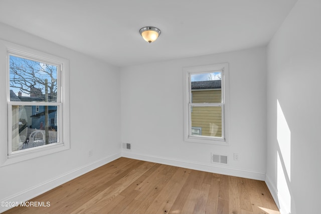 unfurnished room featuring light hardwood / wood-style flooring