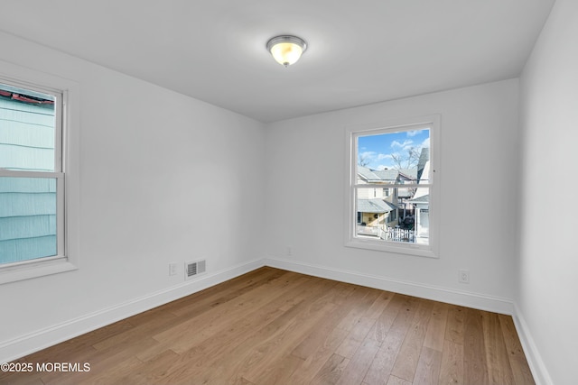 unfurnished room featuring light hardwood / wood-style flooring