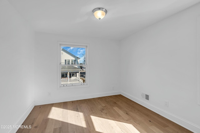 unfurnished room featuring light hardwood / wood-style floors