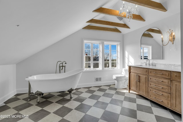 bathroom featuring toilet, vanity, a bath, and vaulted ceiling with beams