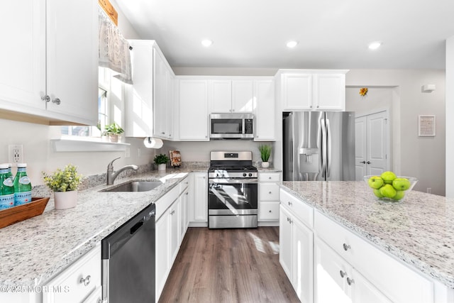 kitchen featuring sink, stainless steel appliances, and white cabinets