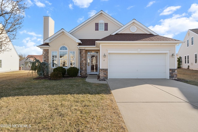 view of front property featuring a garage and a front lawn