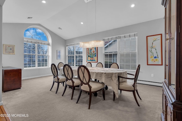 dining area with light carpet and lofted ceiling