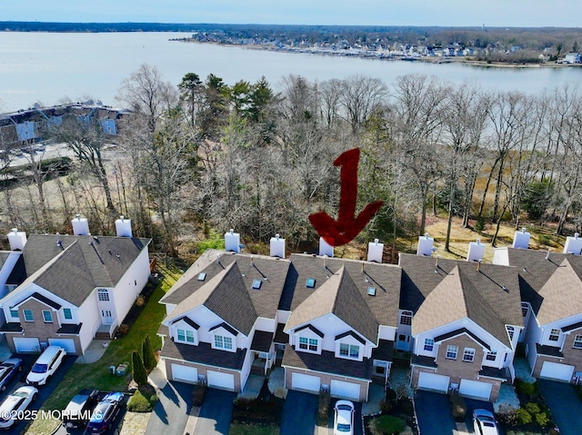 birds eye view of property featuring a water view