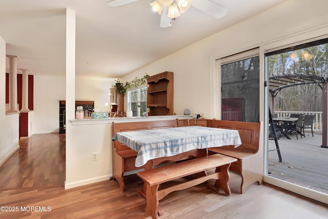 657 Toms River Rd, Jackson, NJ 08527 - dining space featuring decorative columns, wood finished floors, baseboards, and ceiling fan