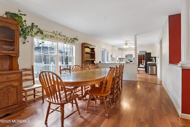 657 Toms River Rd, Jackson, NJ 08527 - dining room featuring baseboards, light wood-type flooring, and a ceiling fan