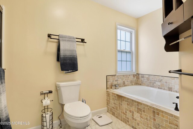 657 Toms River Rd, Jackson, NJ 08527 - full bathroom featuring tile patterned floors, toilet, baseboards, and a garden tub