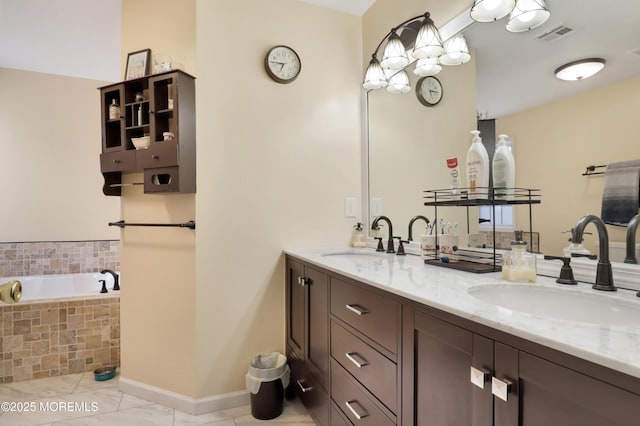 657 Toms River Rd, Jackson, NJ 08527 - bathroom with a relaxing tiled tub, double vanity, a sink, and baseboards