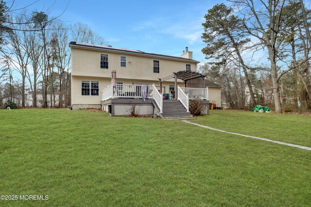 657 Toms River Rd, Jackson, NJ 08527 - back of property with a yard, a pergola, a deck, and a chimney