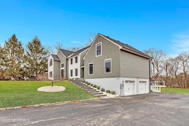 view of front of property featuring a garage and a front yard