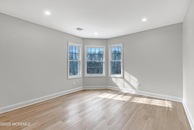 unfurnished room featuring light hardwood / wood-style floors