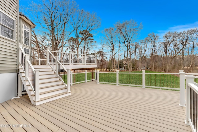 wooden terrace with a lawn