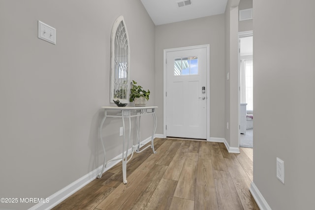 foyer with light hardwood / wood-style floors