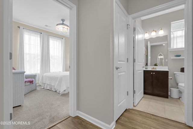 bathroom featuring hardwood / wood-style flooring, vanity, and toilet