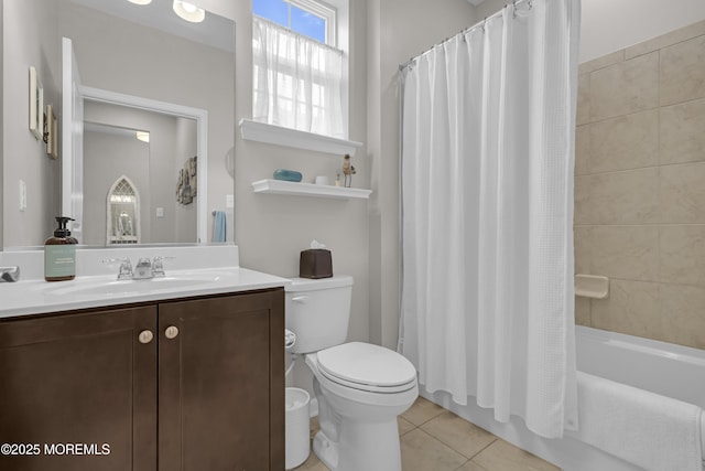 full bathroom with shower / tub combo with curtain, vanity, toilet, and tile patterned flooring